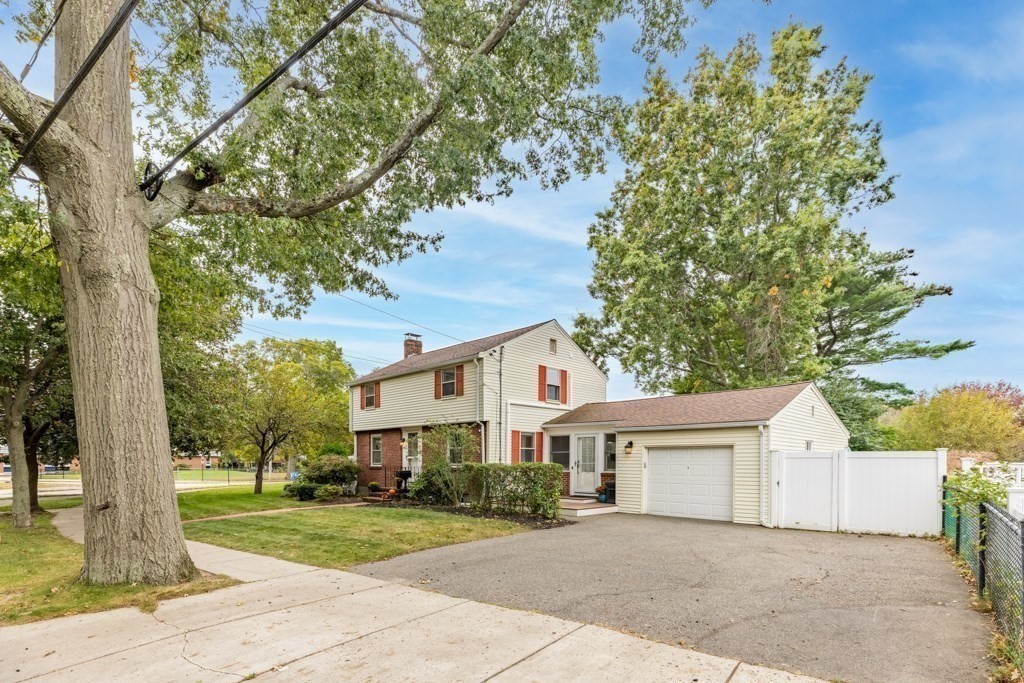 4 Rice Road Quincy, MA 02170 - Photo 5 of 26 a front view of a house with a yard and trees