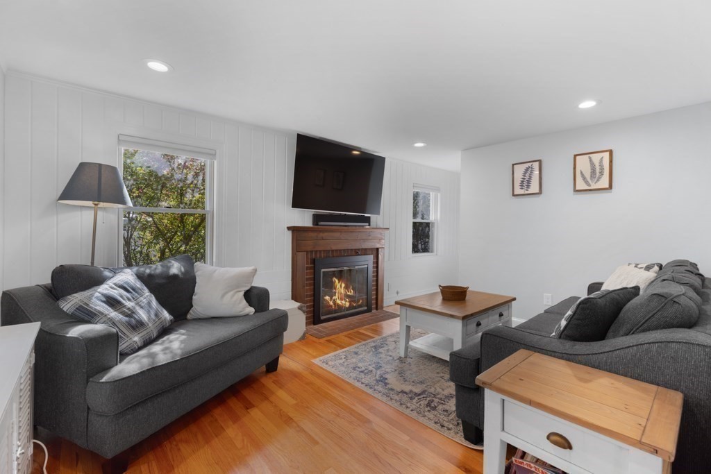 4 Rice Road Quincy, MA 02170 - Photo 6 of 26 a living room with furniture and a fireplace