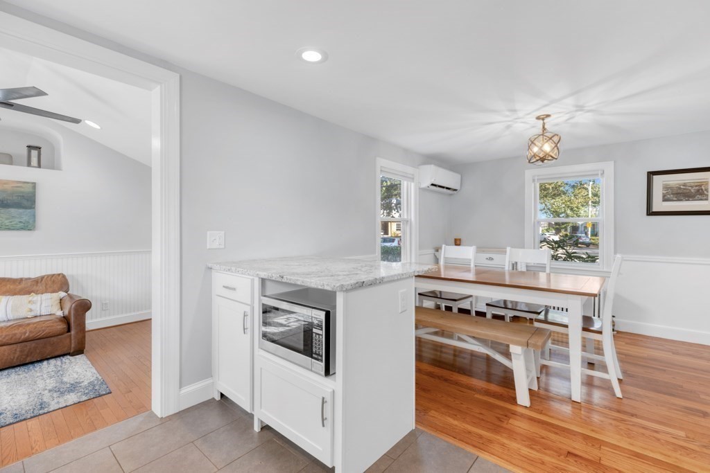 4 Rice Road Quincy, MA 02170 - Photo 9 of 26 a kitchen with a stove and a wooden floors