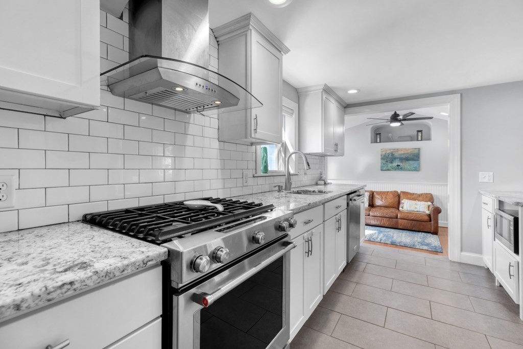 4 Rice Road Quincy, MA 02170 - Photo 10 of 26 a kitchen with stainless steel appliances granite countertop a stove and a sink