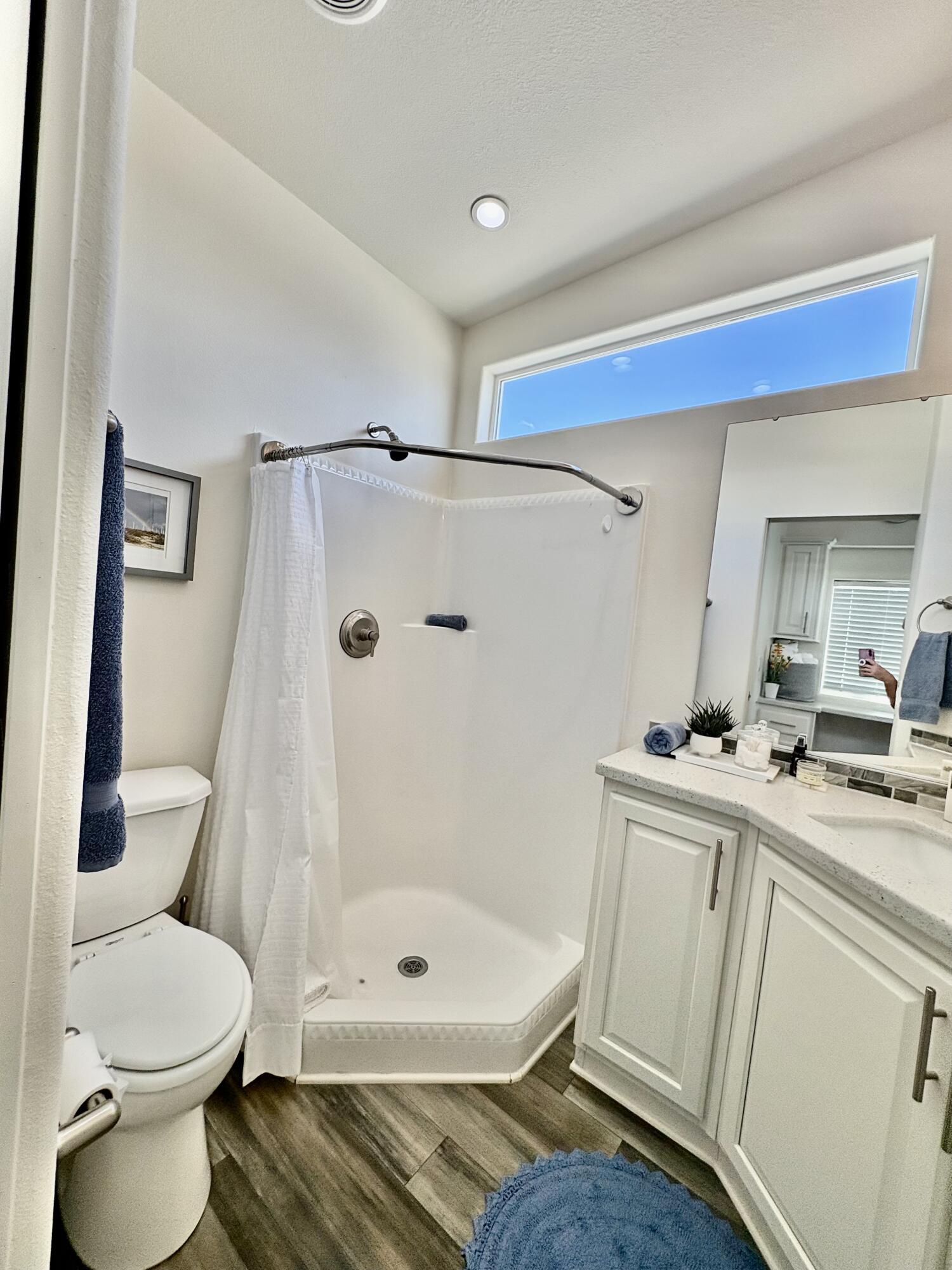 70200 Dillon Road, Unit 200 Desert Hot Springs, CA 92241 - Photo 16 of 31 a bathroom with a sink a toilet and shower