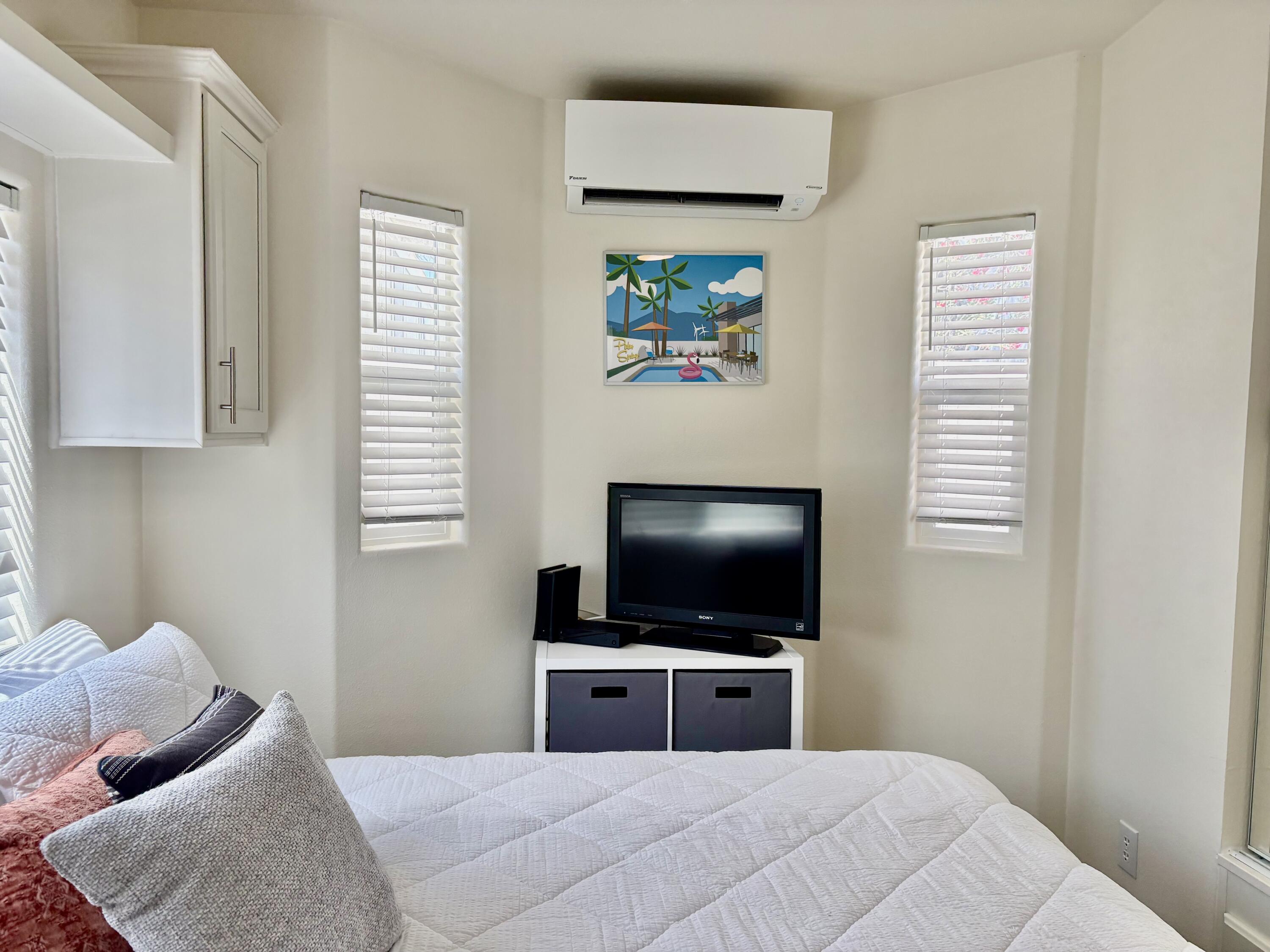 70200 Dillon Road, Unit 200 Desert Hot Springs, CA 92241 - Photo 19 of 31 a bedroom with a bed and a flat screen tv
