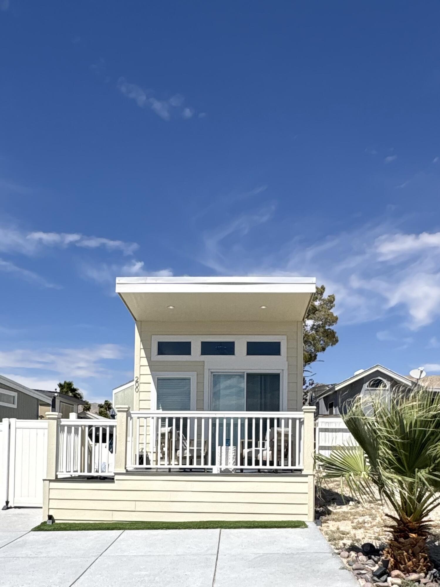 70200 Dillon Road, Unit 200 Desert Hot Springs, CA 92241 - Photo 2 of 31 a view of a house with a balcony