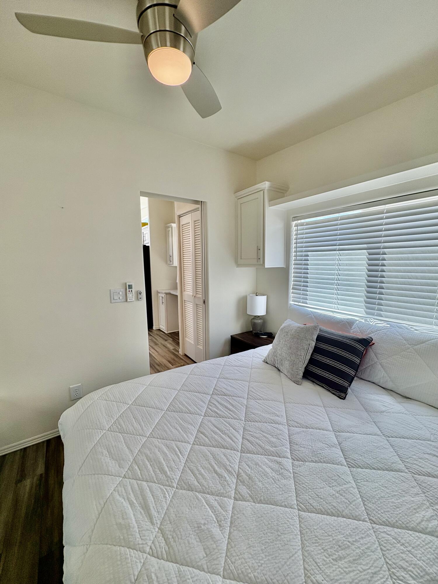 70200 Dillon Road, Unit 200 Desert Hot Springs, CA 92241 - Photo 21 of 31 a bedroom with a bed and a window