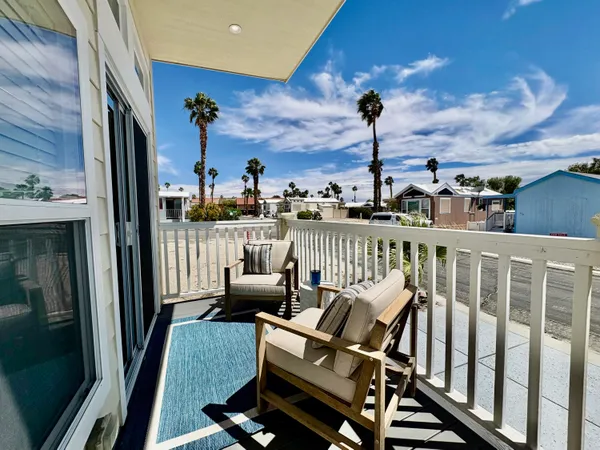 a view of a balcony with chairs