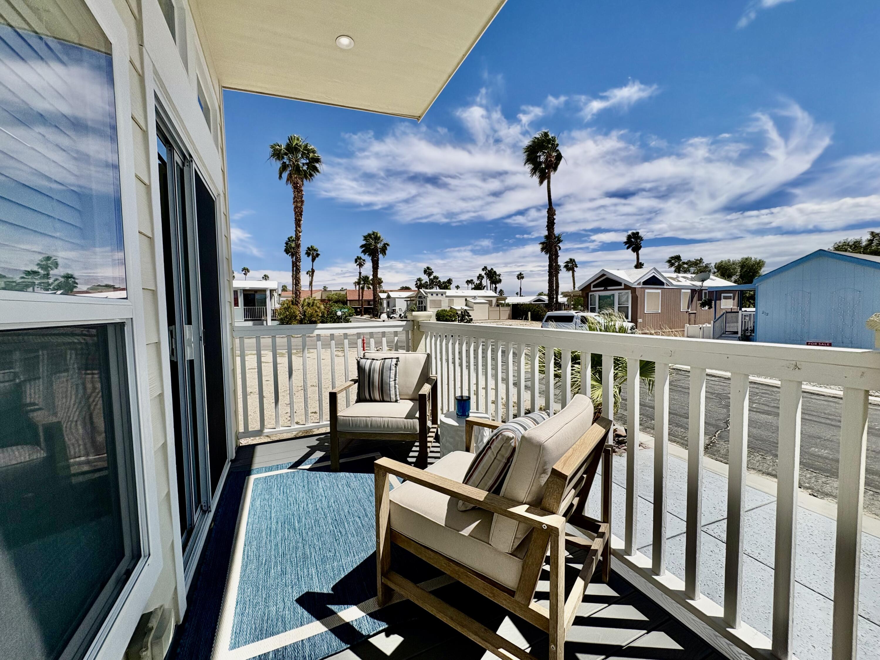 70200 Dillon Road, Unit 200 Desert Hot Springs, CA 92241 - Photo 23 of 31 a view of a balcony with chairs