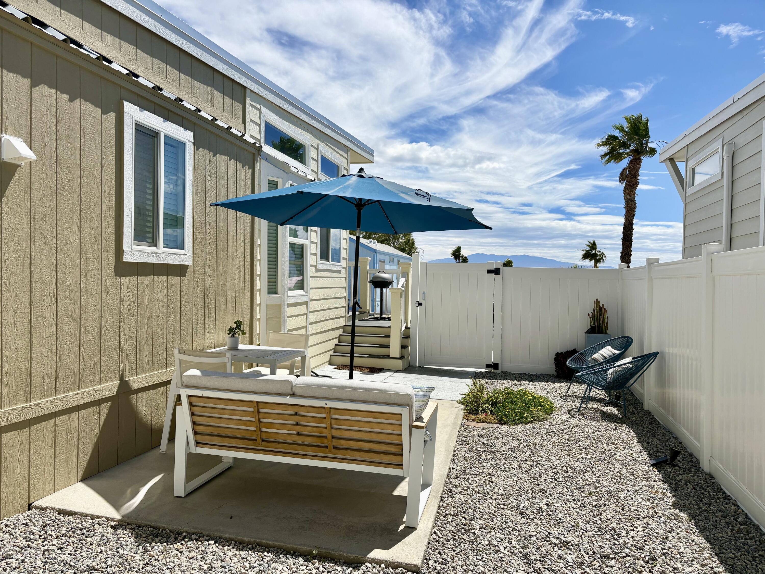 70200 Dillon Road, Unit 200 Desert Hot Springs, CA 92241 - Photo 25 of 31 a balcony with furniture and a potted plant