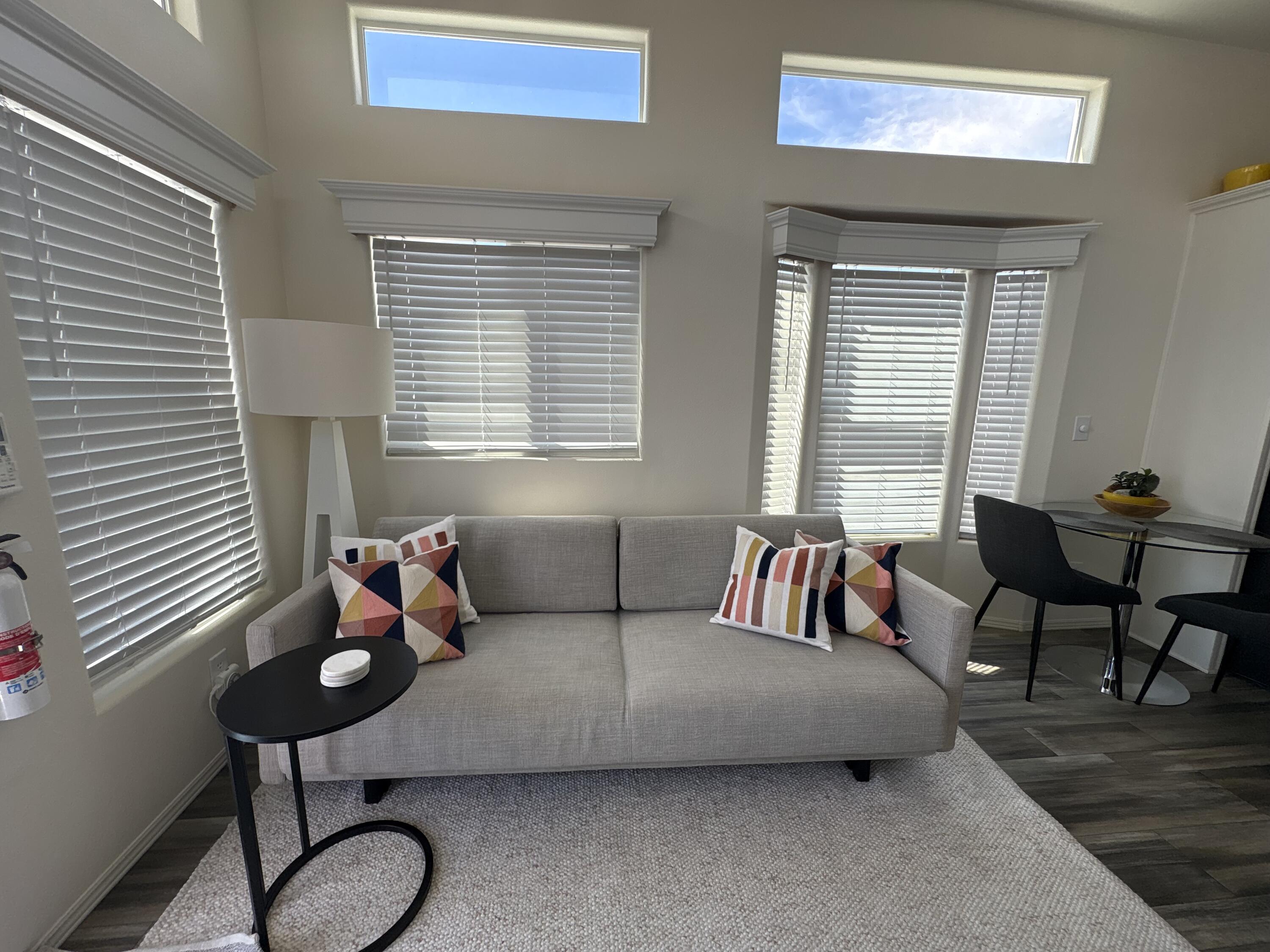 70200 Dillon Road, Unit 200 Desert Hot Springs, CA 92241 - Photo 5 of 31 a bedroom with furniture and a window