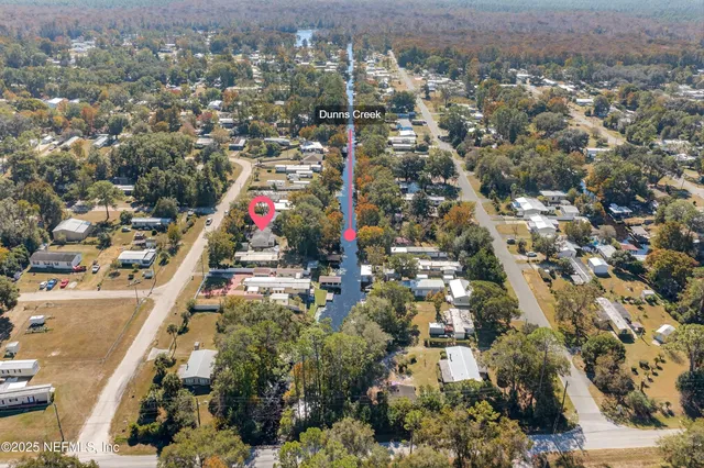 aerial view of a house with a lake view