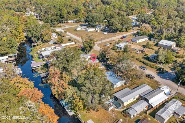an aerial view of residential houses with outdoor space