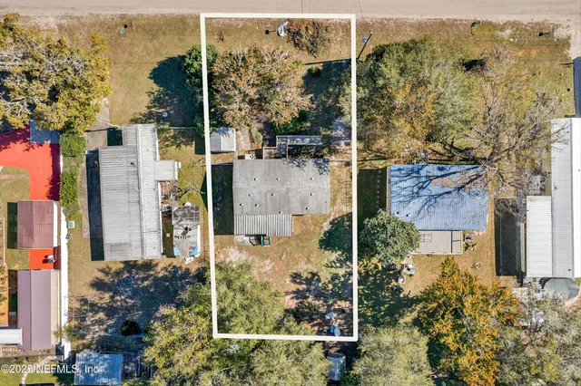 an aerial view of residential houses with outdoor space