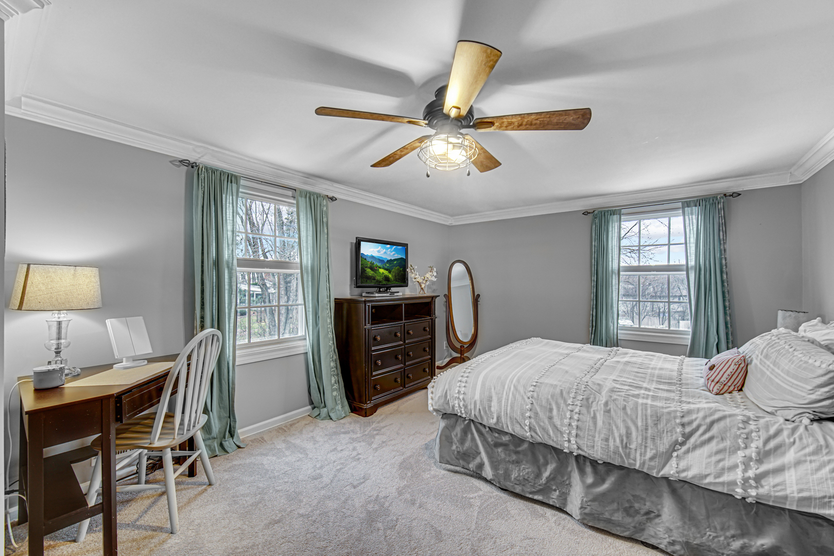 1910 Coventry Road New Lenox, IL 60451 - Photo 11 of 40 a bedroom with a bed a chandelier and a flat tv screen on dresser