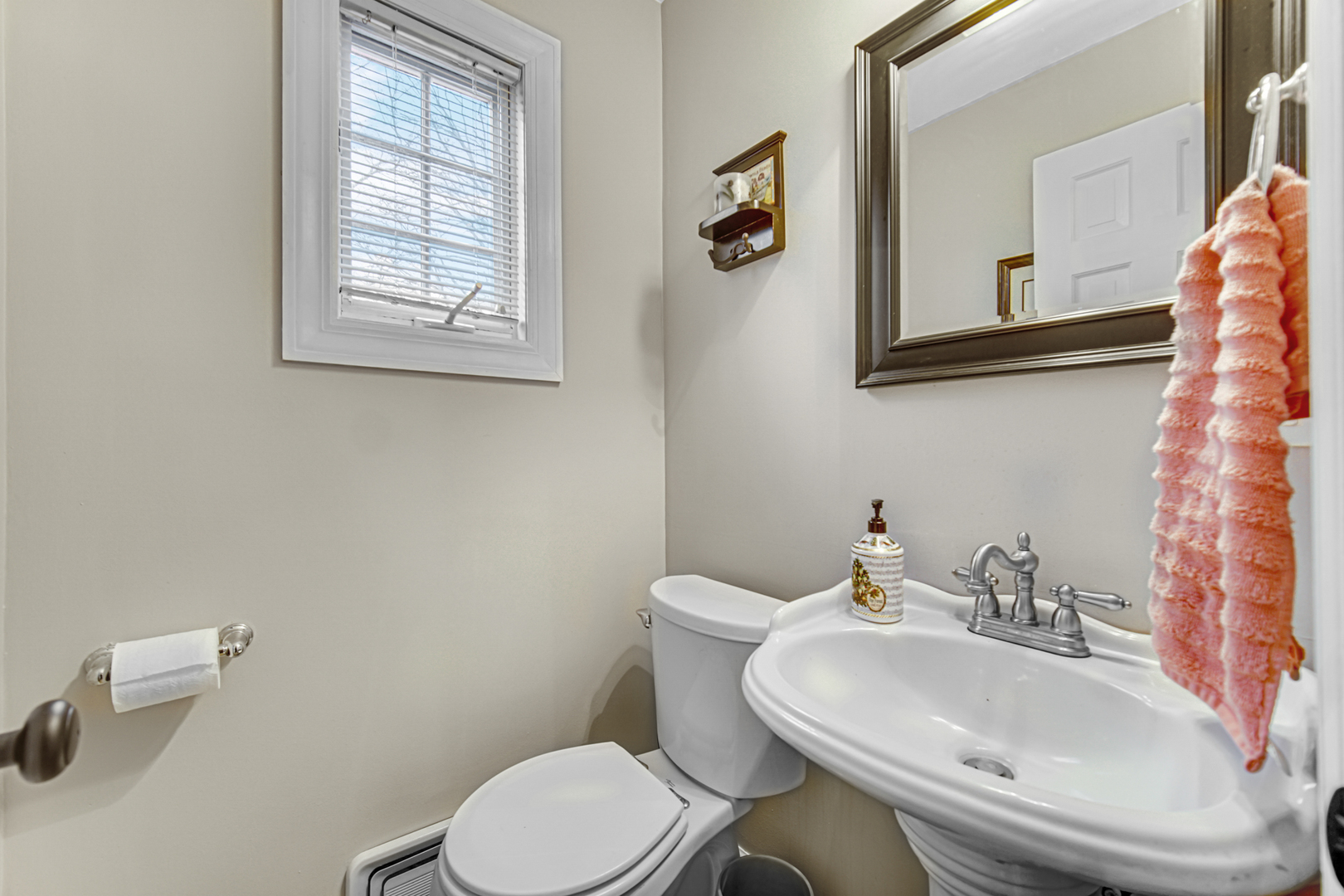 1910 Coventry Road New Lenox, IL 60451 - Photo 22 of 40 a white toilet sitting next to a bathroom sink