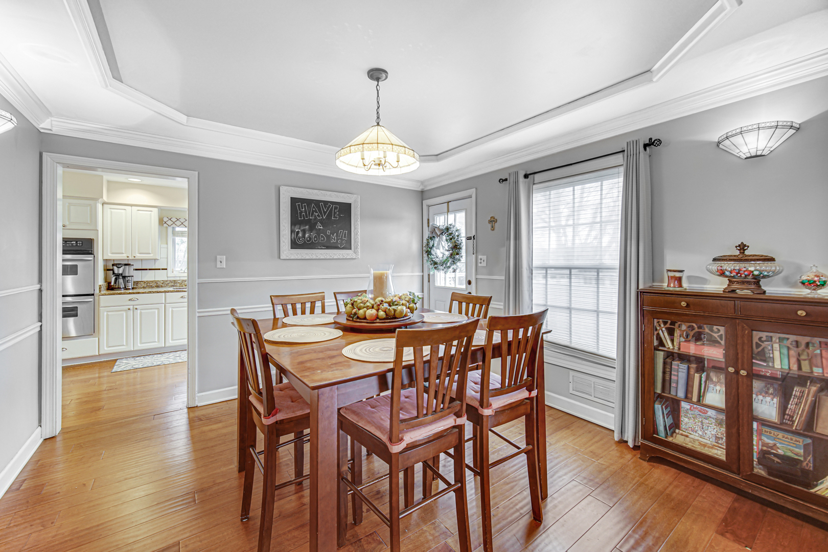 1910 Coventry Road New Lenox, IL 60451 - Photo 9 of 40 a view of a dining room with furniture window and wooden floor