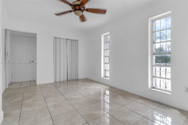 a view of an empty room with a window