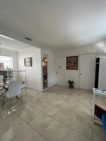a view of livingroom with furniture and workspace