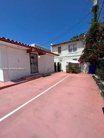 a view of a house with a big yard