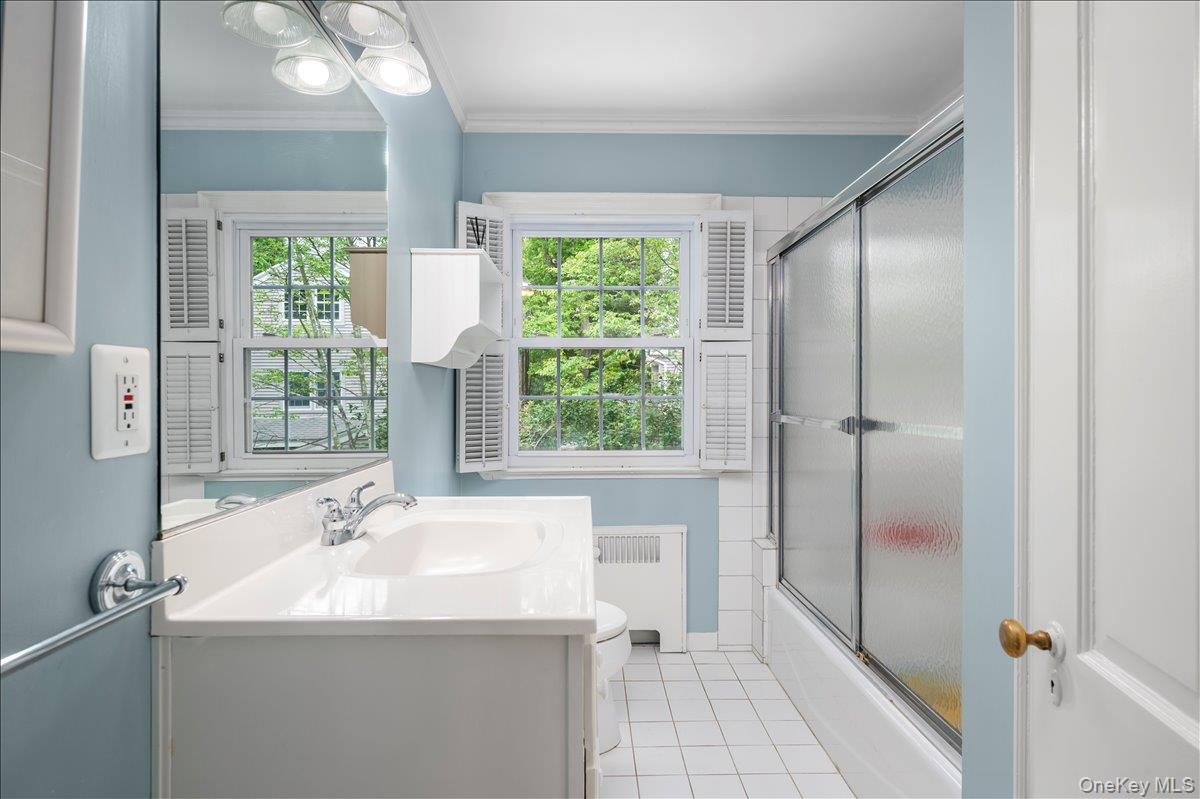 49 Eton Road Larchmont, NY 10538 - Photo 21 of 34 a bathroom with a sink and a mirror