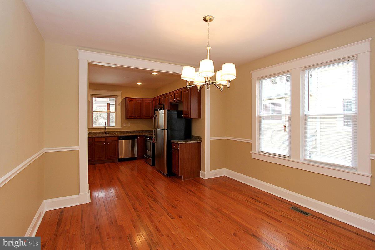3106 Rueckert Avenue Baltimore, MD 21214 - Photo 6 of 29 a view of a livingroom with a furniture wooden floor and chandelier