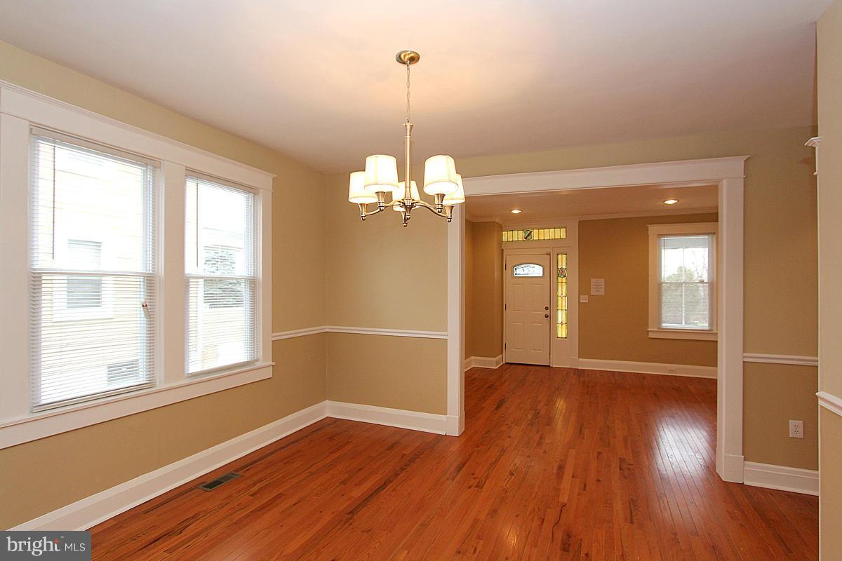 3106 Rueckert Avenue Baltimore, MD 21214 - Photo 8 of 29 a view of a room with wooden floor and windows