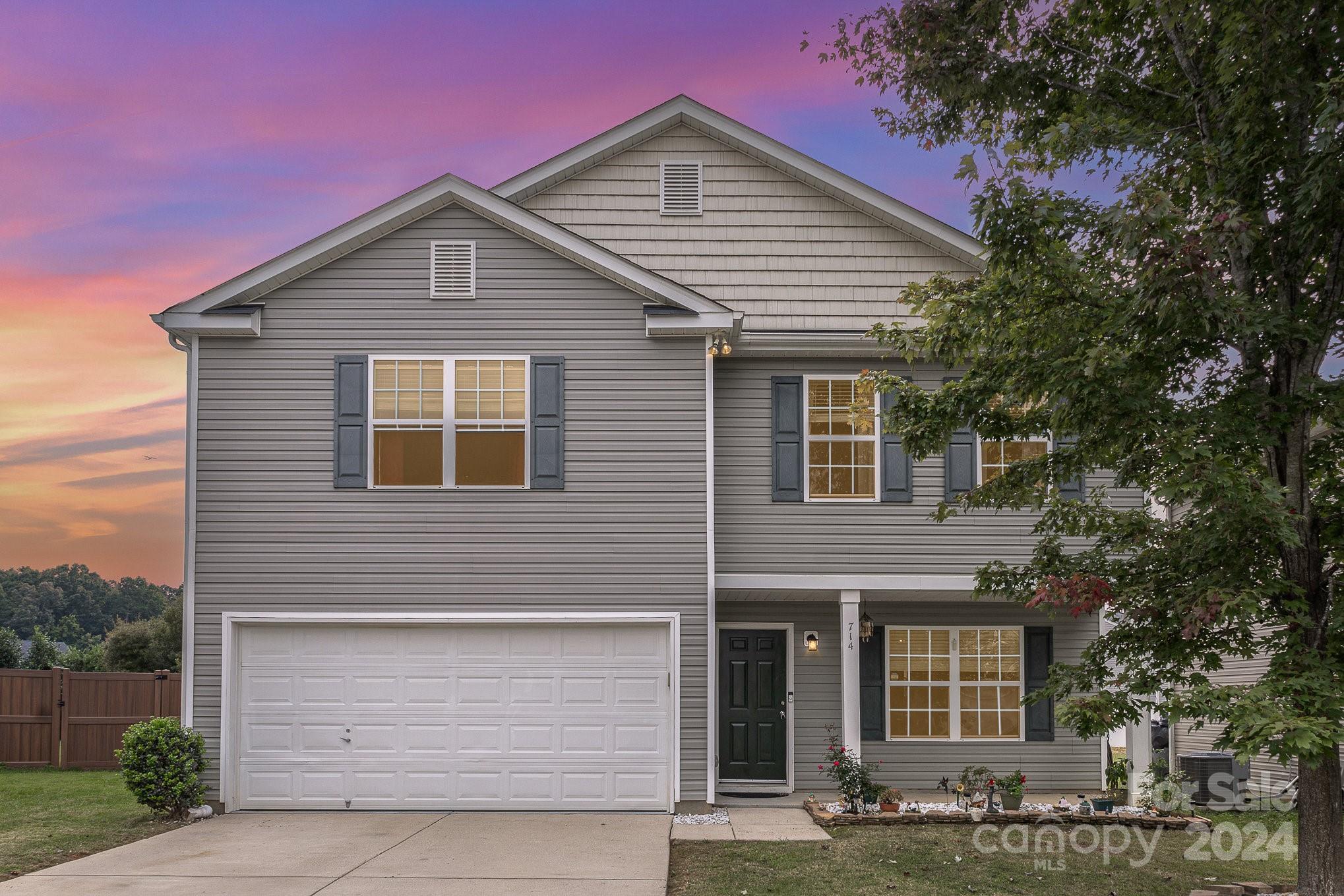 714 Waterlemon Way Monroe, NC 28110 - Photo 1 of 38 a front view of a house with garage