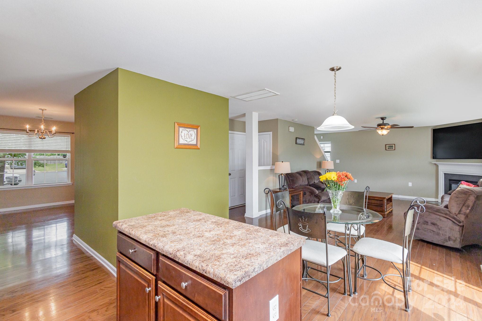 714 Waterlemon Way Monroe, NC 28110 - Photo 18 of 38 a kitchen with a table and chairs in it