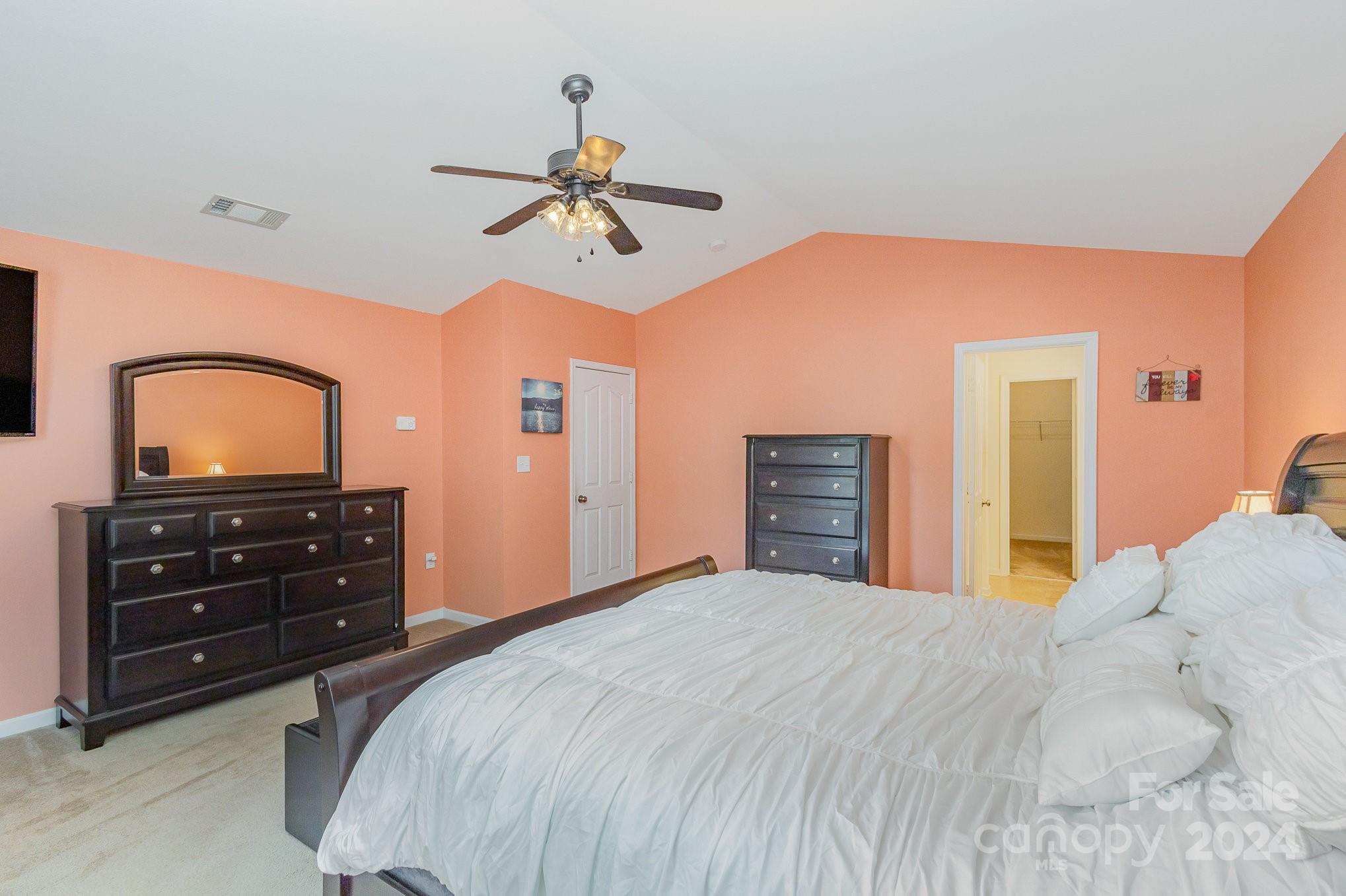714 Waterlemon Way Monroe, NC 28110 - Photo 24 of 38 a bedroom with a bed and a dresser