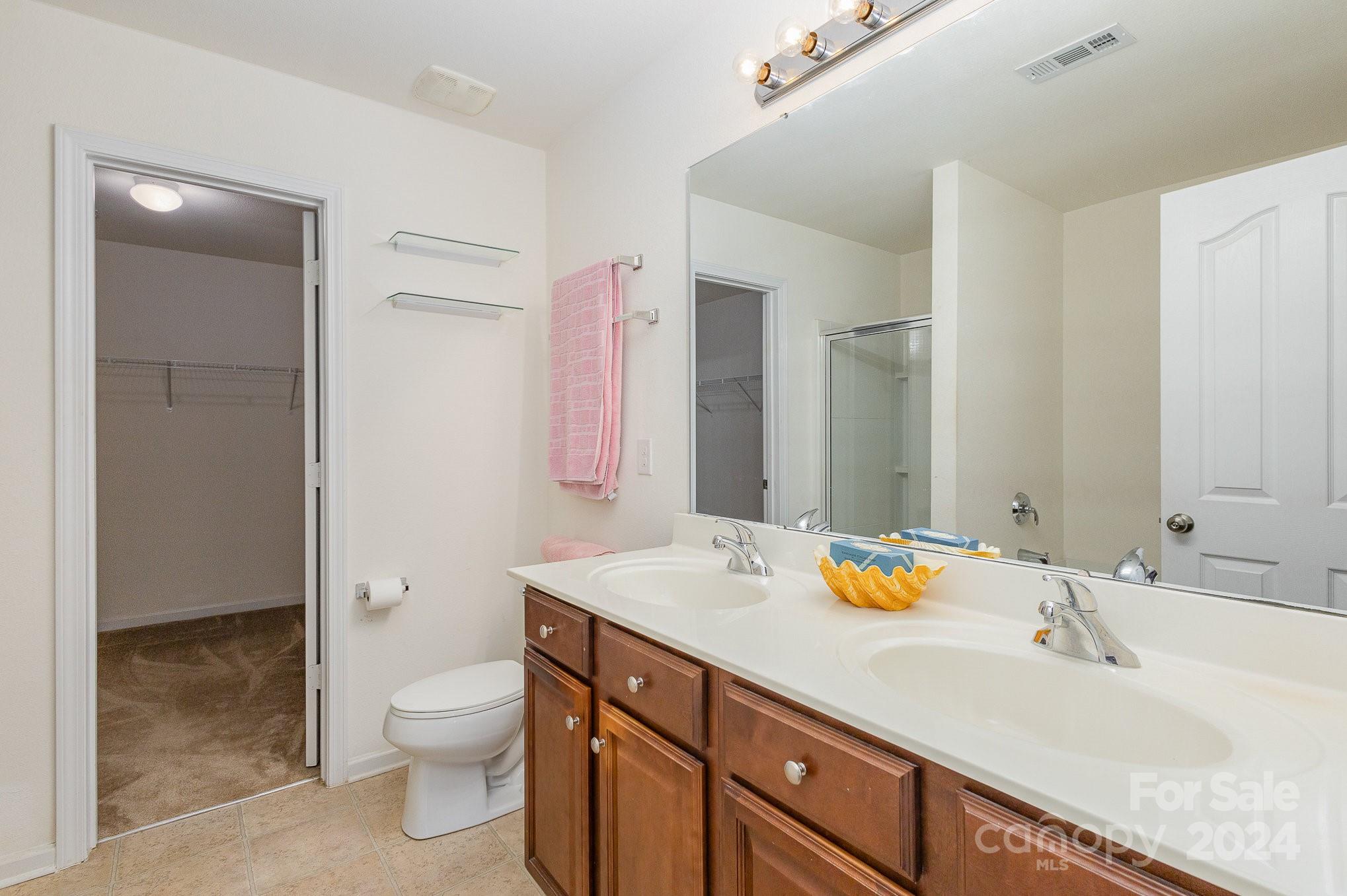 714 Waterlemon Way Monroe, NC 28110 - Photo 25 of 38 a bathroom with a sink and a mirror
