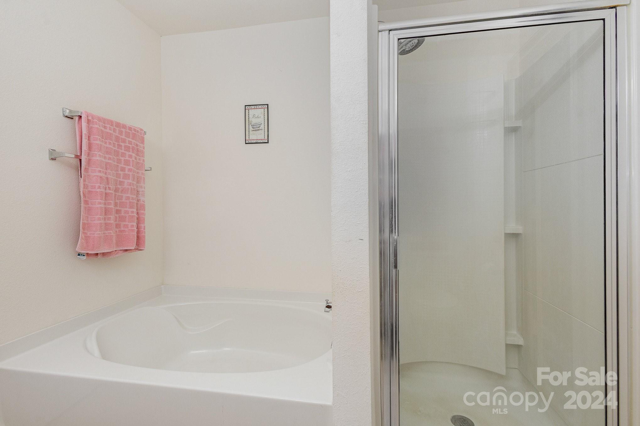 714 Waterlemon Way Monroe, NC 28110 - Photo 26 of 38 a bathroom with a bathtub and shower
