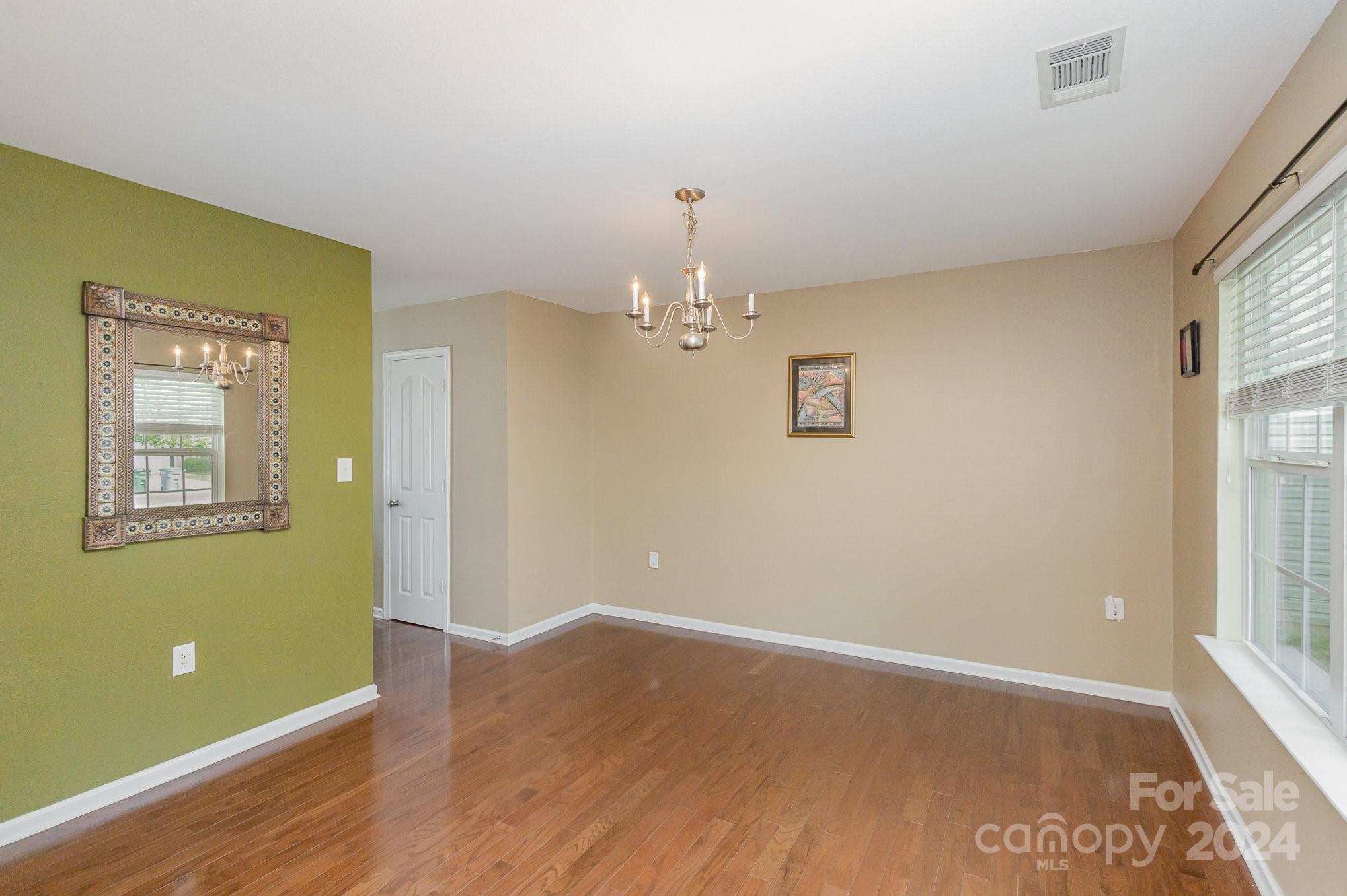 714 Waterlemon Way Monroe, NC 28110 - Photo 3 of 38 a view of livingroom with hardwood floor and window
