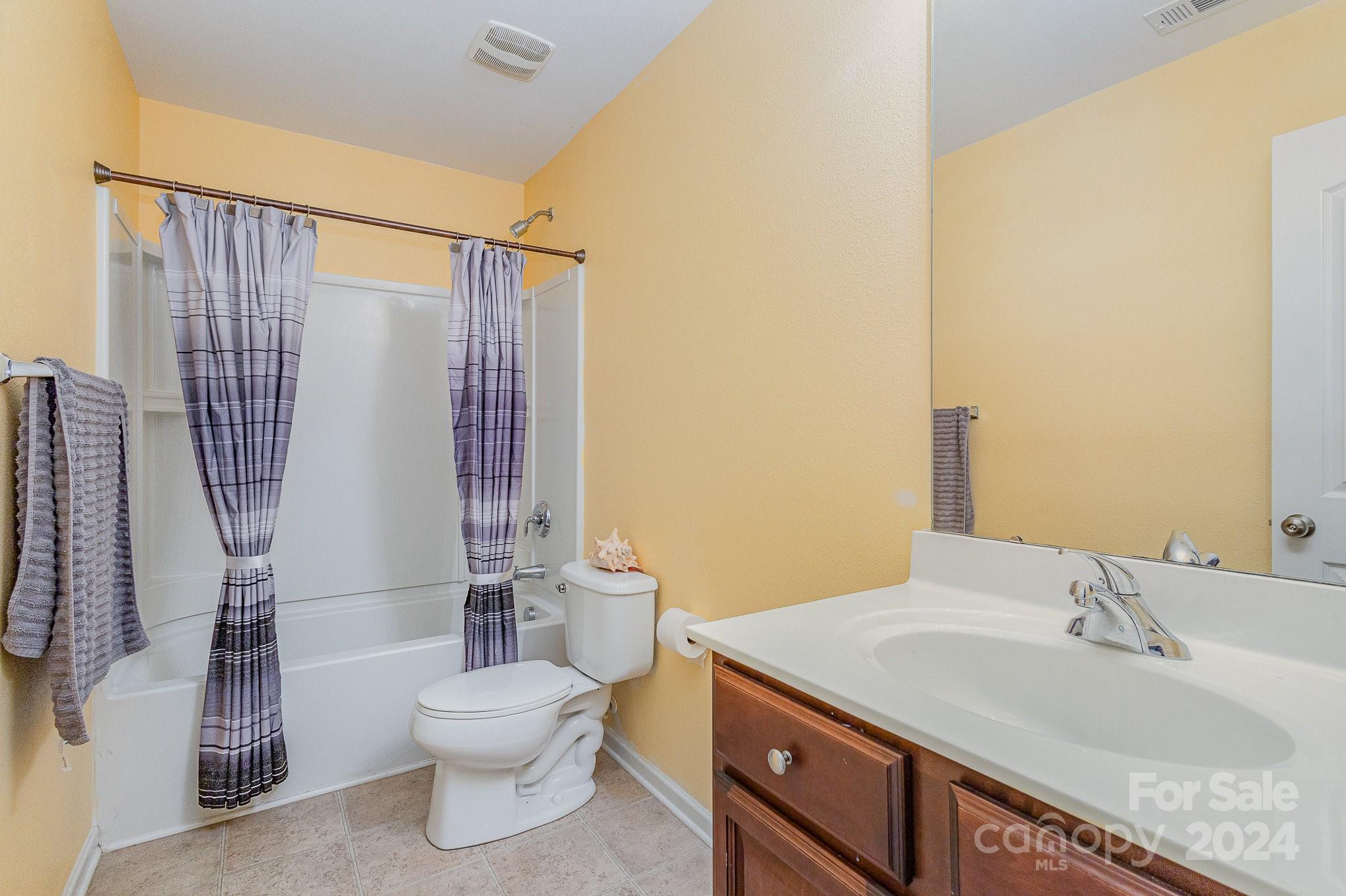 714 Waterlemon Way Monroe, NC 28110 - Photo 31 of 38 a bathroom with a granite countertop sink toilet and shower