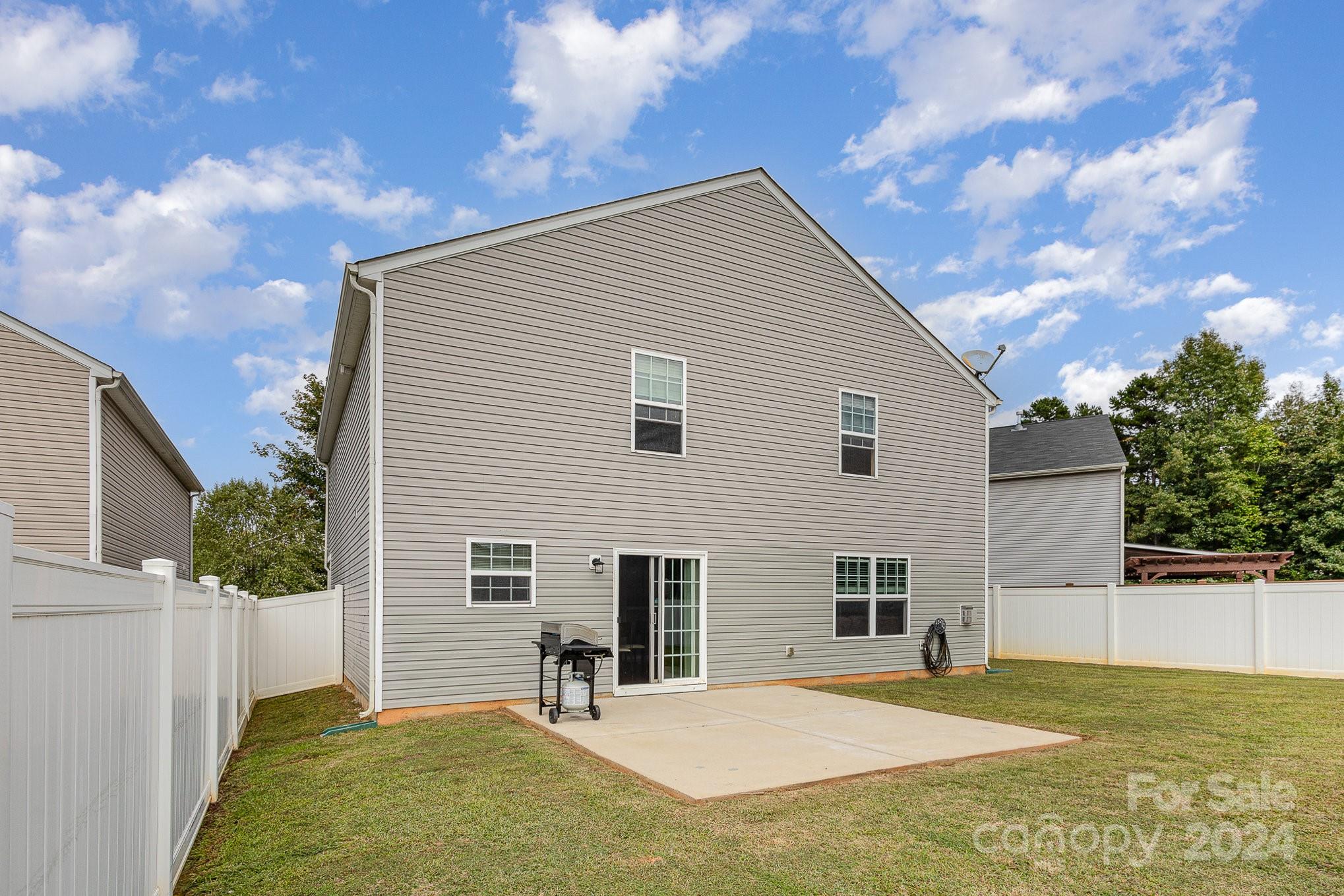 714 Waterlemon Way Monroe, NC 28110 - Photo 35 of 38 a backyard of a house with seating space