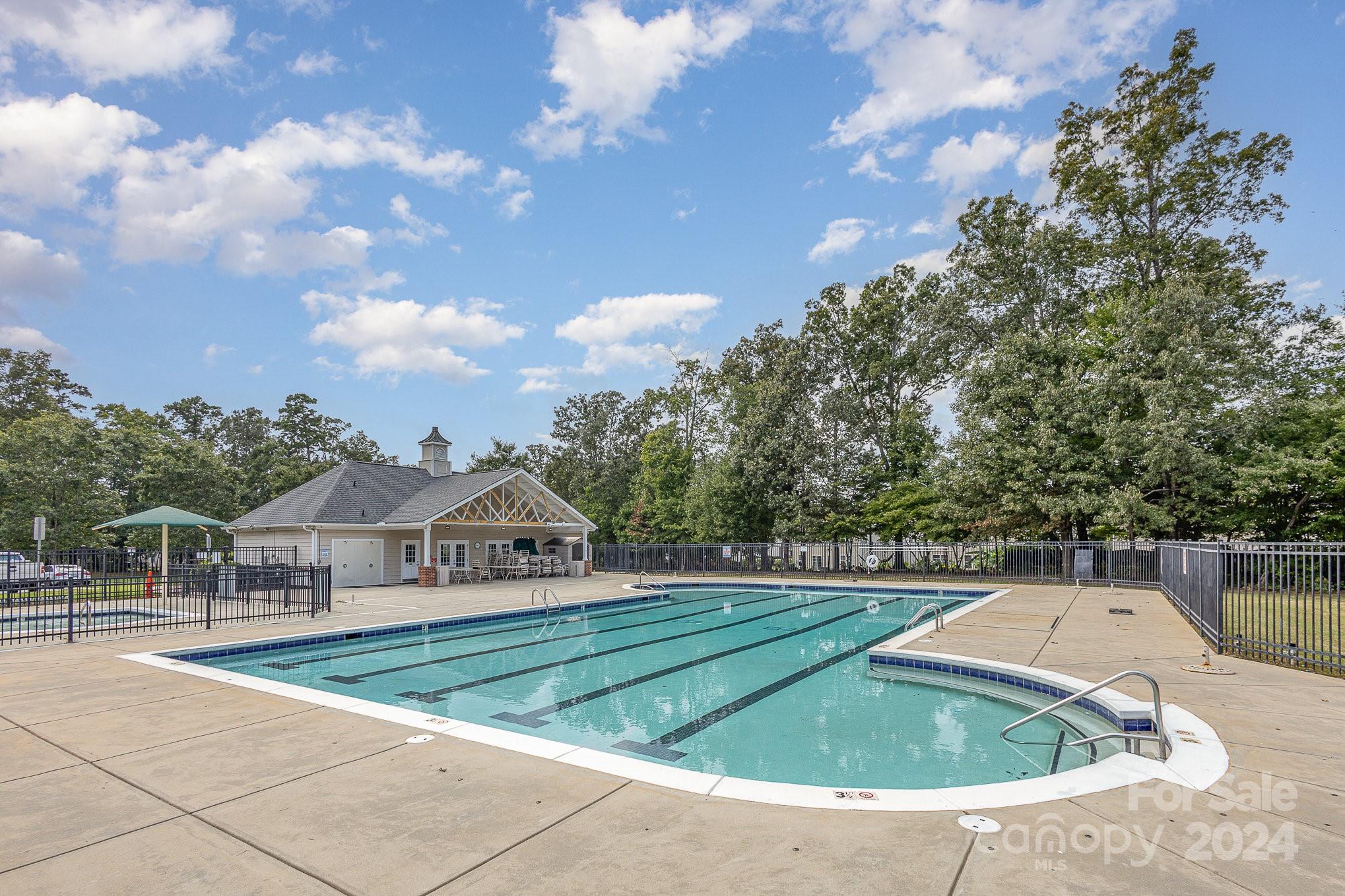 714 Waterlemon Way Monroe, NC 28110 - Photo 37 of 38 a view of house with swimming pool and trees in the background