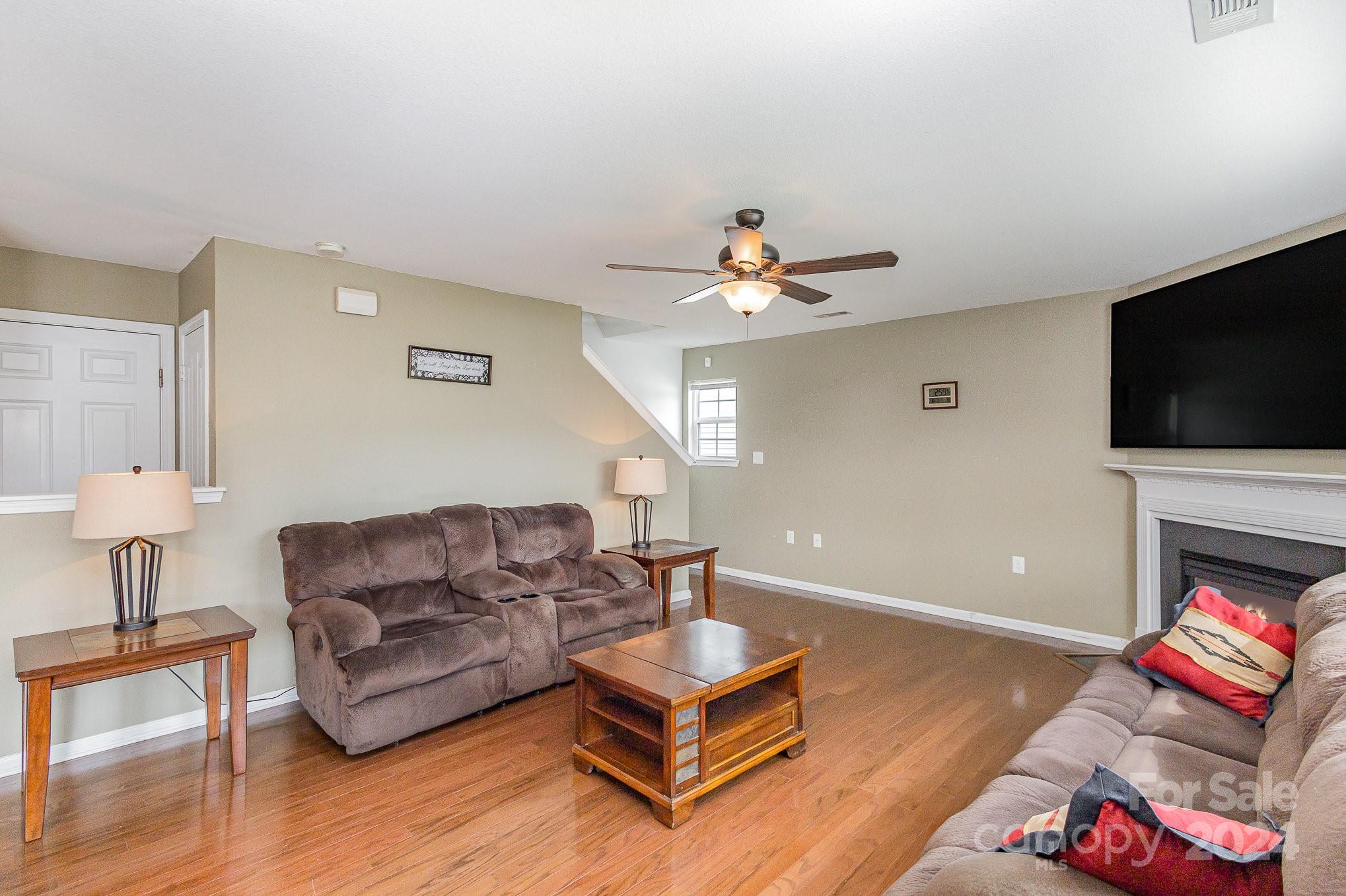 714 Waterlemon Way Monroe, NC 28110 - Photo 6 of 38 a living room with furniture and a flat screen tv