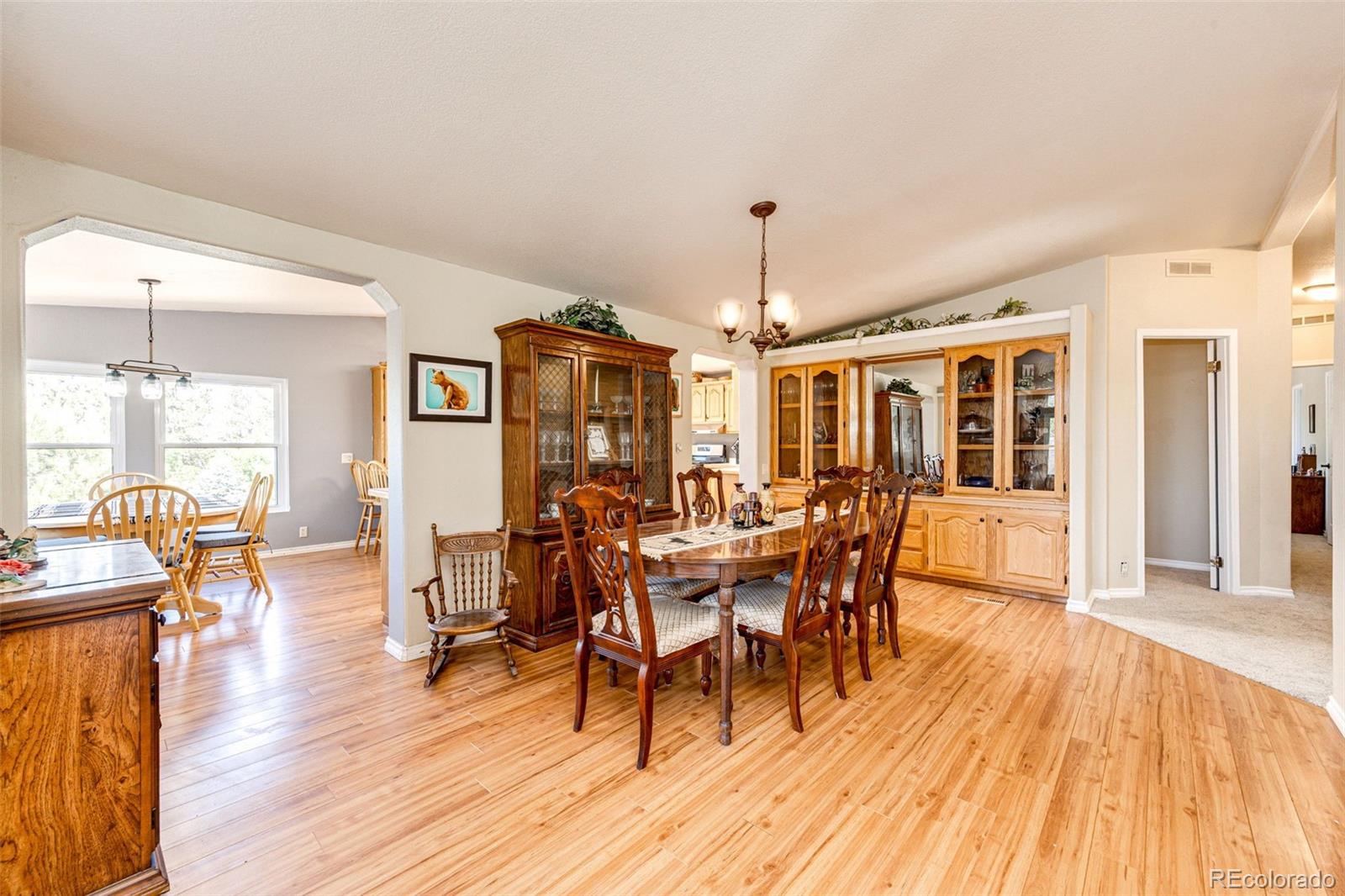36810 View Ridge Drive Elizabeth, CO 80107 - Photo 20 of 46 a view of a dining room with furniture window and wooden floor