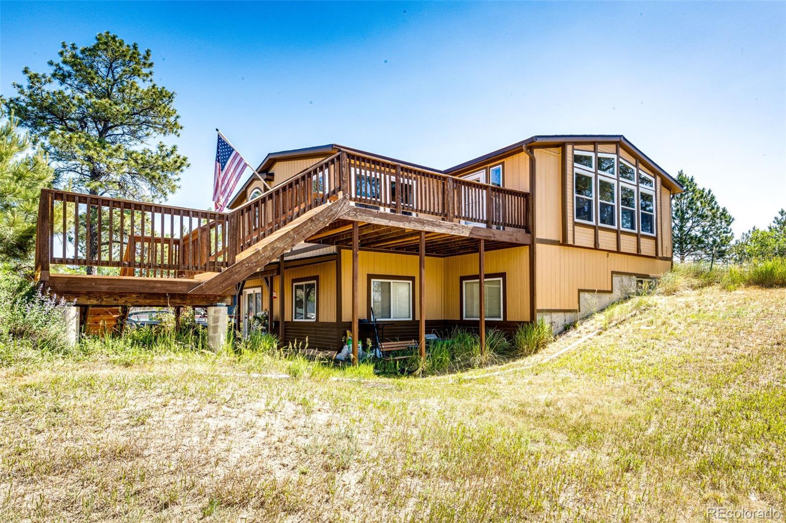 36810 View Ridge Drive Elizabeth, CO 80107 - Photo 2 of 46 a front view of a house with a yard