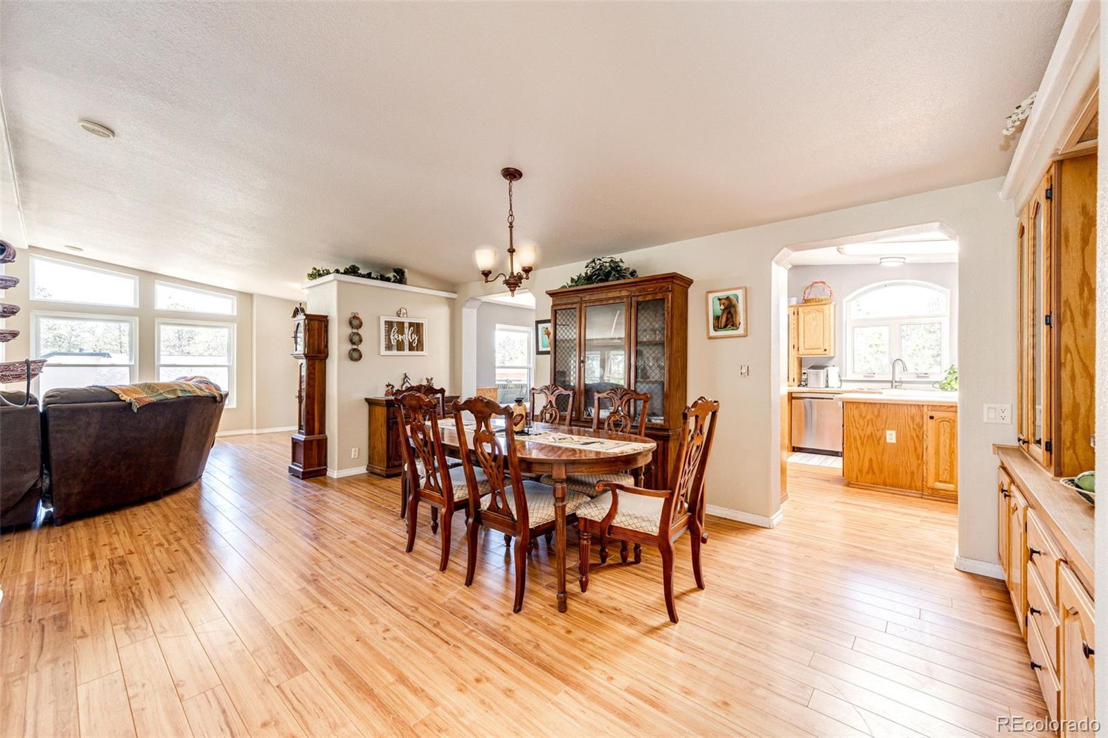 36810 View Ridge Drive Elizabeth, CO 80107 - Photo 21 of 46 a view of a dining room with furniture window and wooden floor