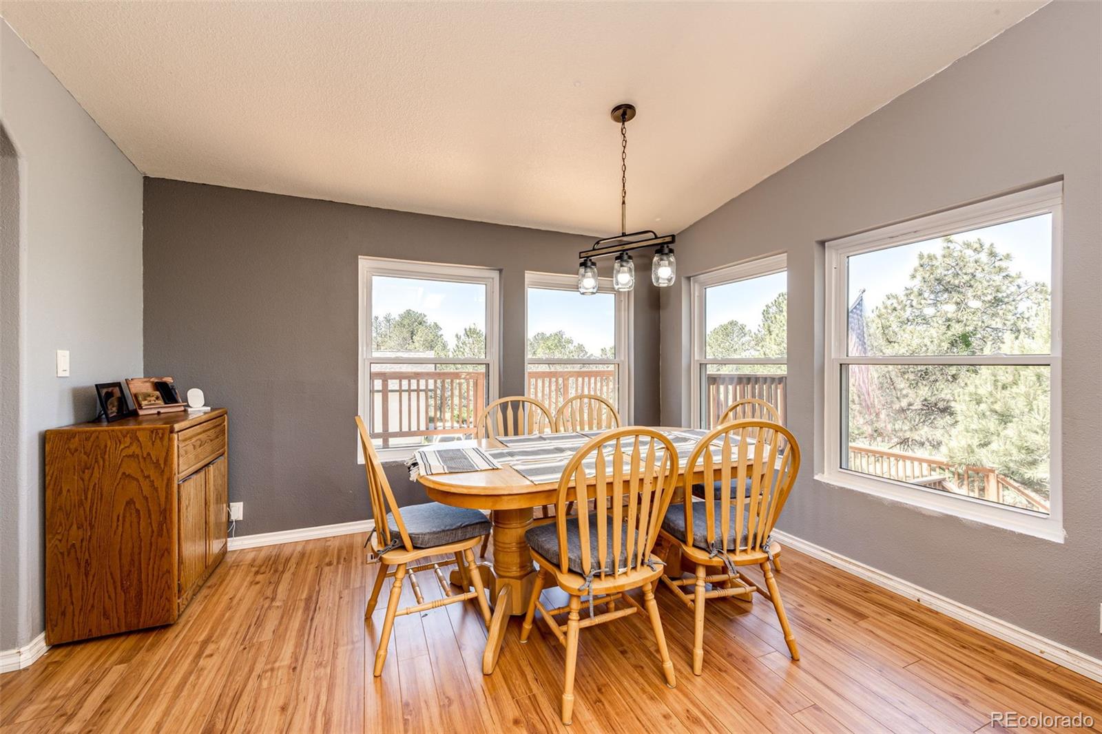 36810 View Ridge Drive Elizabeth, CO 80107 - Photo 23 of 46 a view of a dining room with furniture window and wooden floor