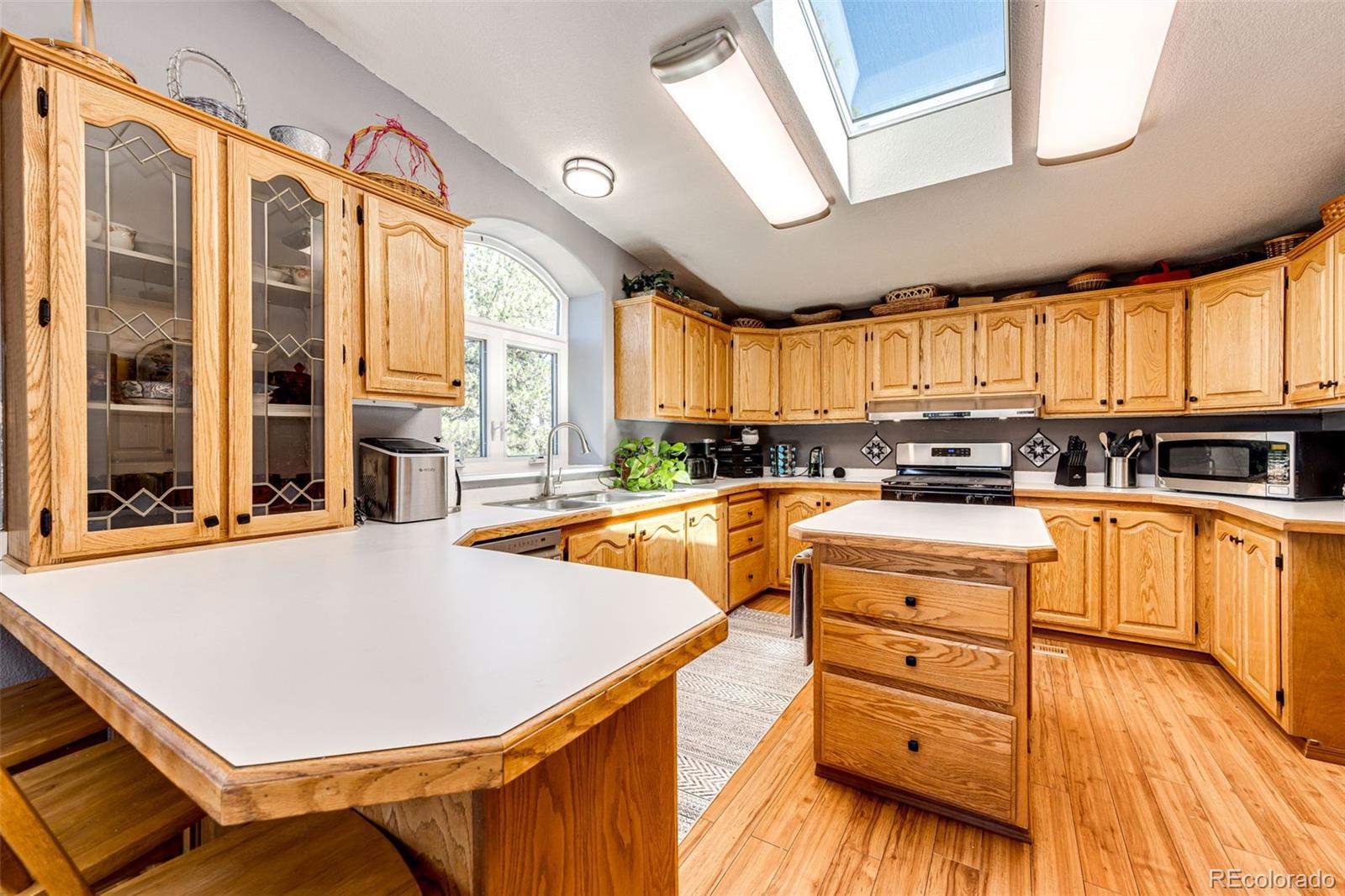 36810 View Ridge Drive Elizabeth, CO 80107 - Photo 26 of 46 a kitchen with stainless steel appliances a stove a sink and cabinets