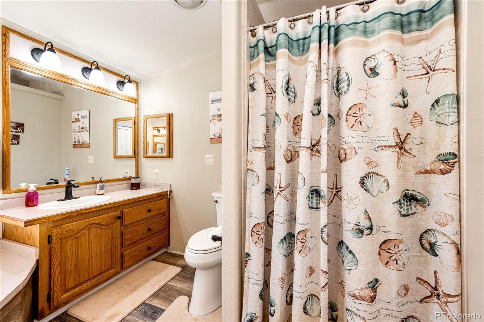 36810 View Ridge Drive Elizabeth, CO 80107 - Photo 34 of 46 a bathroom with a sink toilet and shower