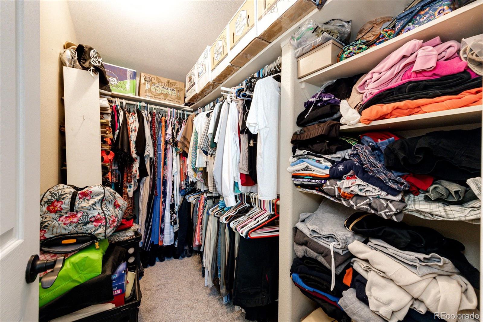 36810 View Ridge Drive Elizabeth, CO 80107 - Photo 35 of 46 a view of walk in closet with clothes and shoes