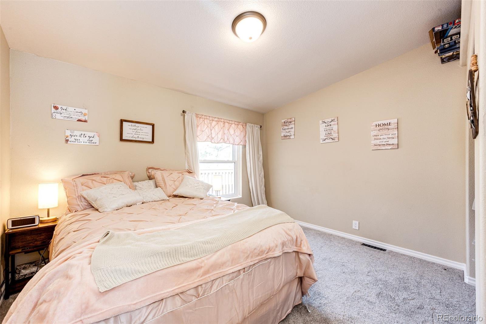 36810 View Ridge Drive Elizabeth, CO 80107 - Photo 36 of 46 a bedroom with a bed and a window