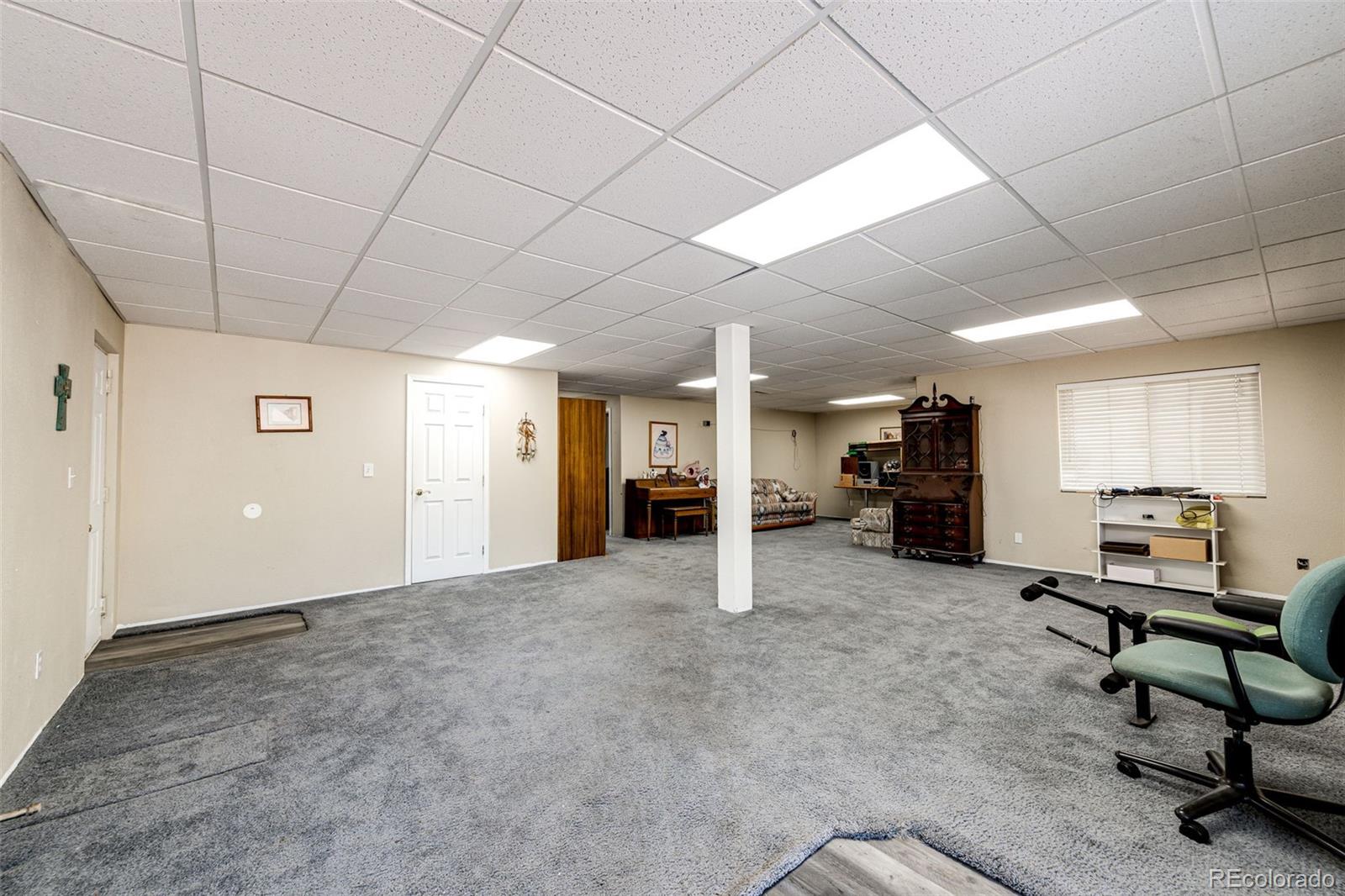 36810 View Ridge Drive Elizabeth, CO 80107 - Photo 40 of 46 a view of a livingroom with workspace and a window