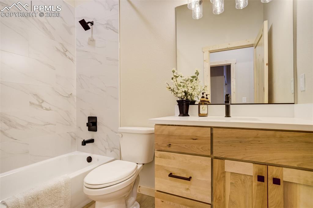 162 Kernite Lane Divide, CO 80814 - Photo 26 of 29 a bathroom with a sink a toilet and shower