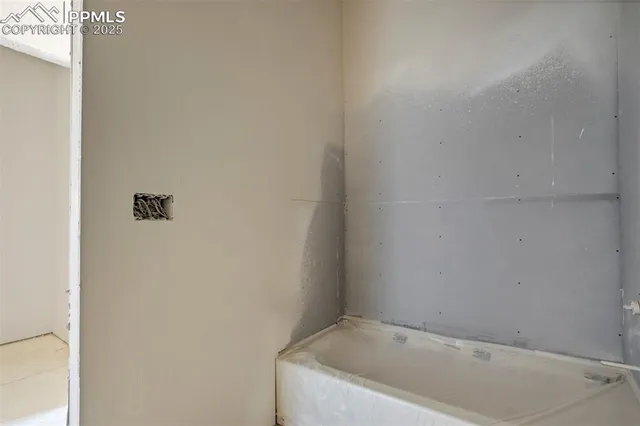 a view of a backyard with sitting area