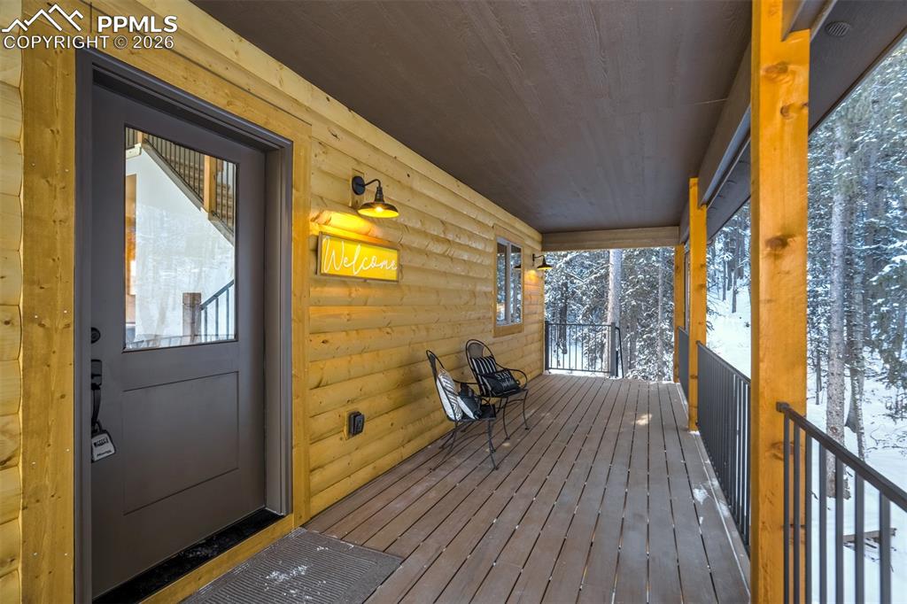 162 Kernite Lane Divide, CO 80814 - Photo 5 of 29 a view of a balcony with wooden floor