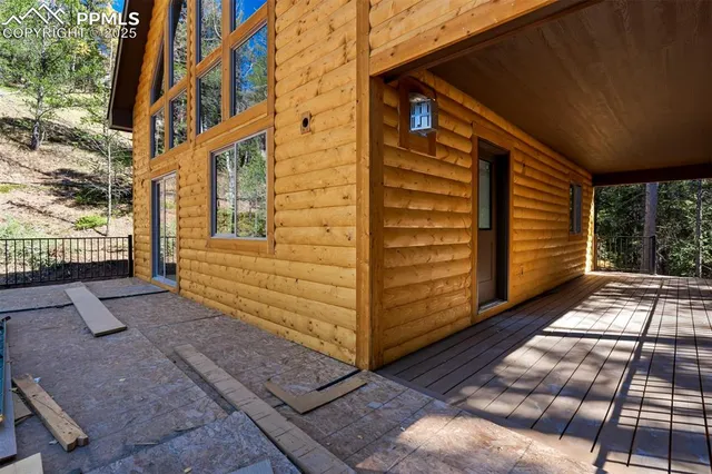 a view of front door of house with stairs
