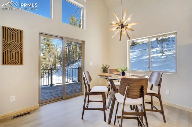 a kitchen with a sink a counter space appliances and cabinets