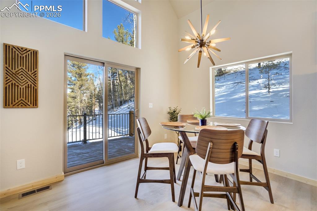 162 Kernite Lane Divide, CO 80814 - Photo 8 of 29 a view of a dining room with furniture window and outside view