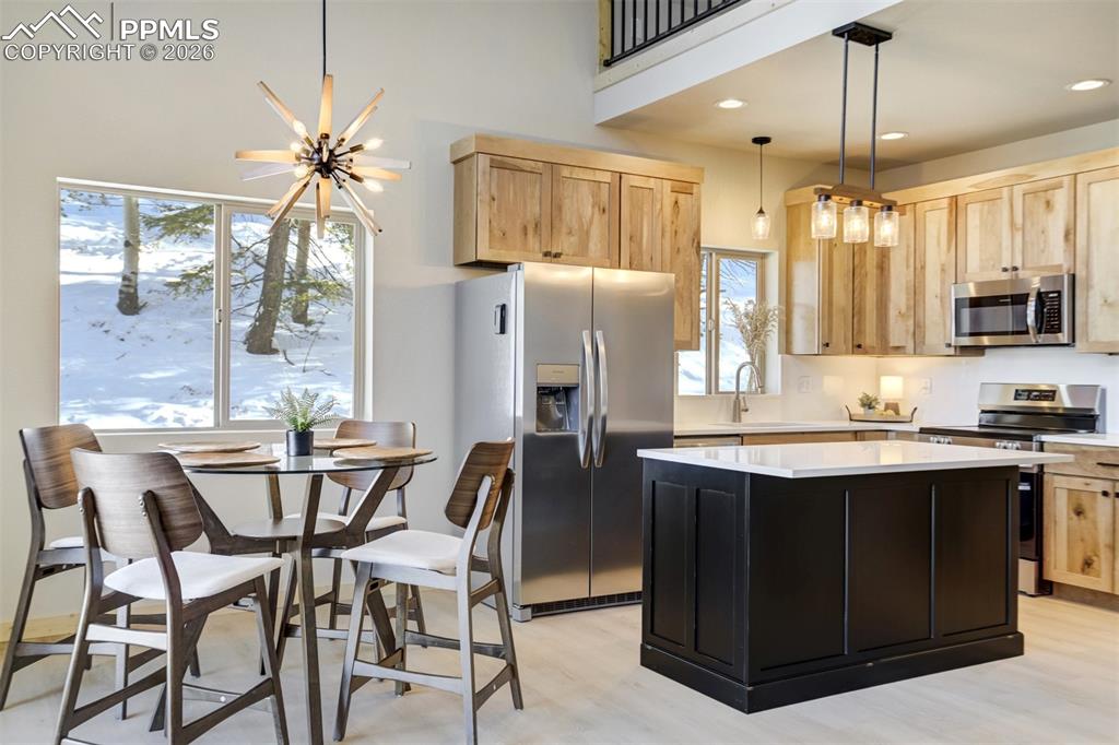 162 Kernite Lane Divide, CO 80814 - Photo 10 of 29 a view of a dining room with furniture